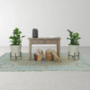 Lifestyle shot highlighting the small console table styled in a neutral hallway with potted plants and woven baskets
