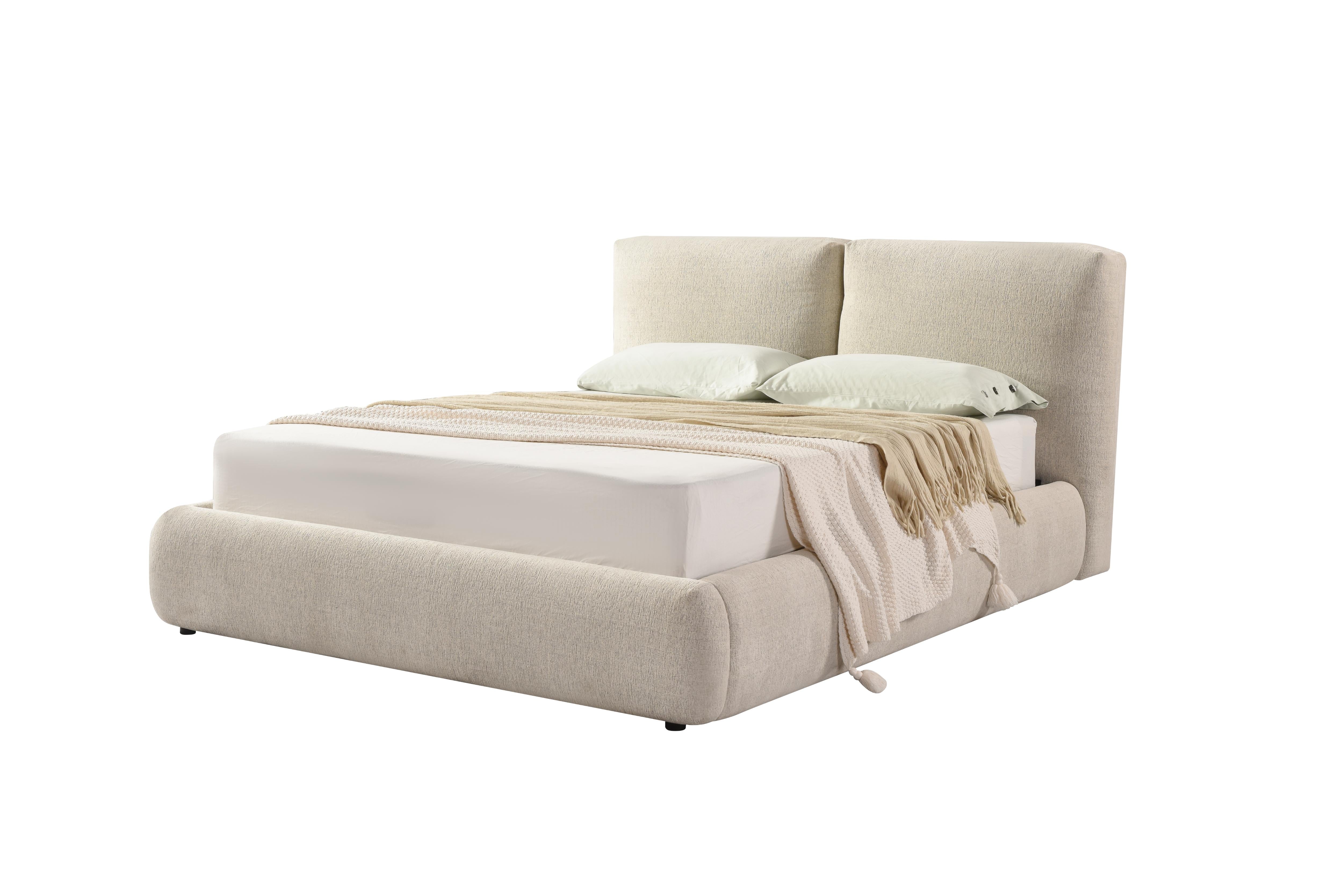 Front view of the Drom upholstered storage bed featuring a low-profile cream bouclé frame and a unique split-panel cushioned headboard