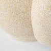 Macro close-up of the cream and tan variegated honeycomb bouclé upholstery on the Estelle chair.