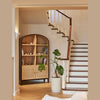 Close-up lifestyle shot highlighting the shelving units styled with books, ceramic vases, and decorative objects
