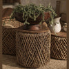 Overview of D-Bodhi Knut side table surface with an open book and coffee