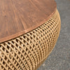 Close up of woven abaca fibers meeting the smooth wood table top edge