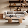 Lifestyle view of Dahlia loveseat in a warm interior with wood coffee table