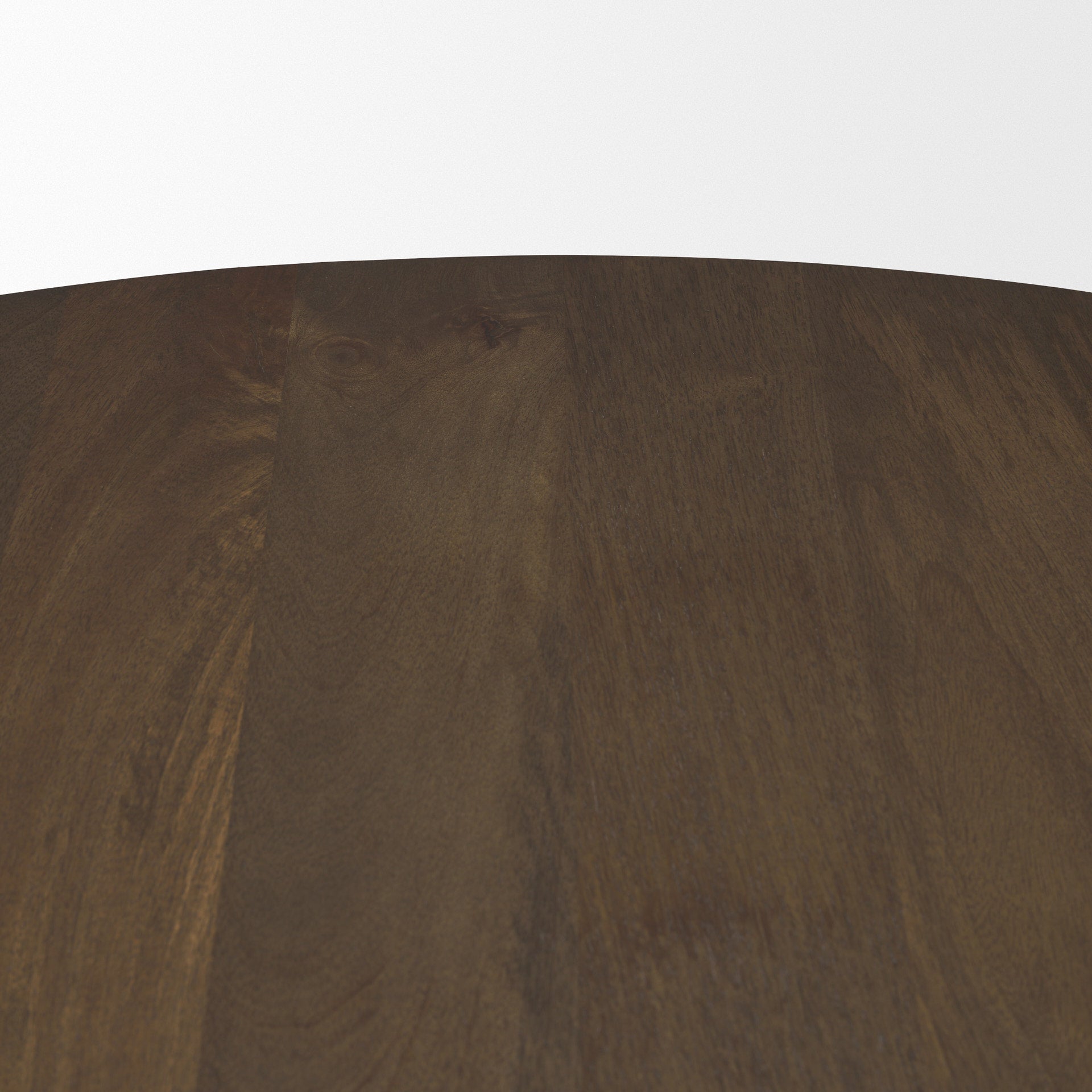 Front view of the Jovani round dining table in a dark mango wood finish featuring a sculptural faceted pedestal base