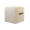 Front view of the Delight cubic ottoman in cream bouclé fabric featuring a soft-edge design and a brown leather side handle