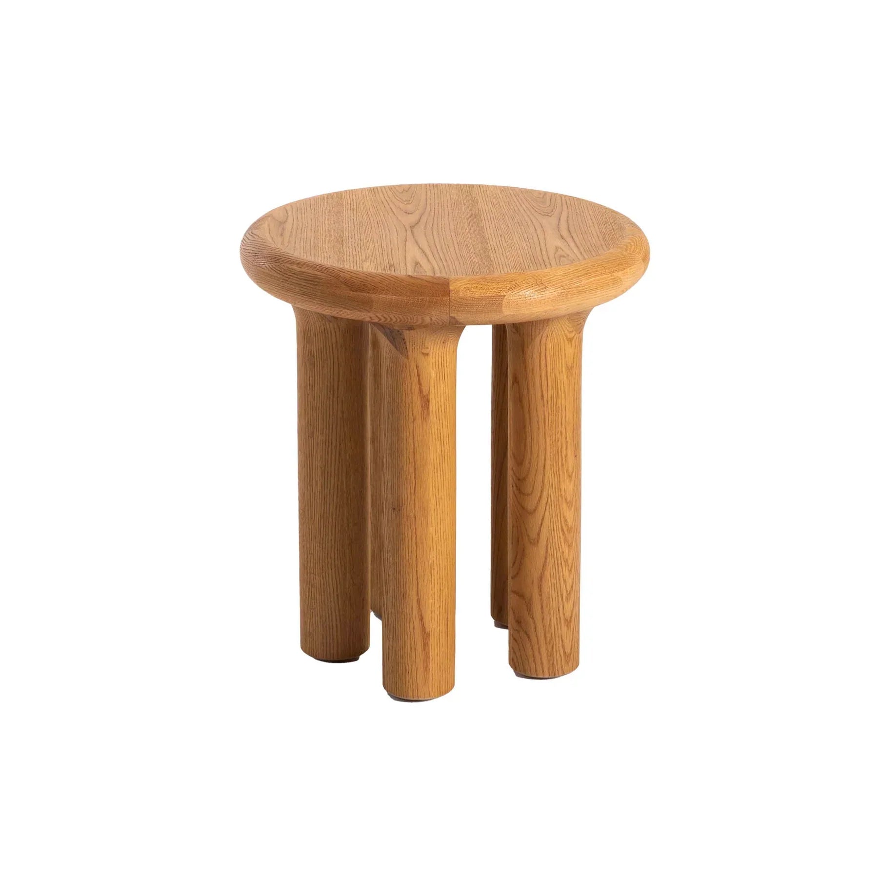 Front view of the Destiny side table featuring a thick circular oak top and four chunky cylindrical pedestal legs in a warm natural finish