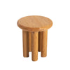 High-angle perspective view emphasizing the circular tabletop and the rich organic grain of the solid oak construction