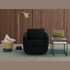 Lifestyle shot featuring the Dharma nesting tables styled next to a modern black swivel armchair in a contemporary living space
