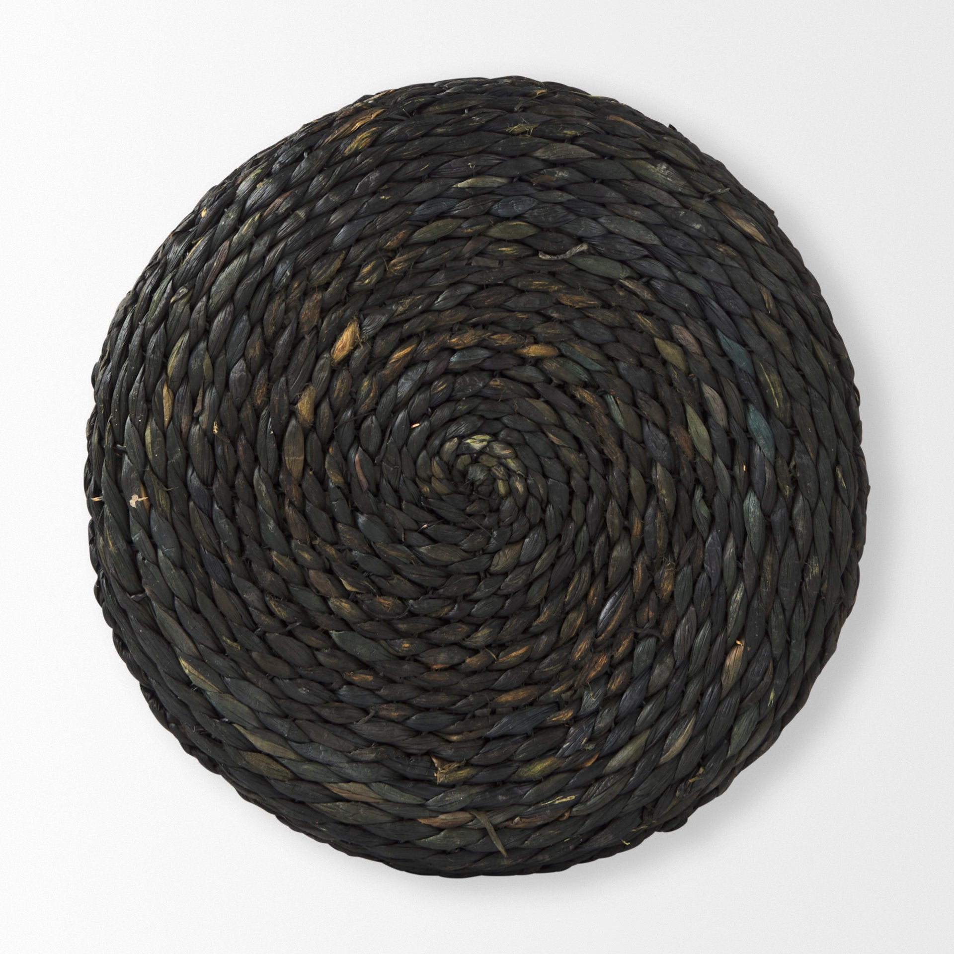Overhead view of the Dina pouf highlighting the tight spiral weaving pattern of the natural fibers on the circular top