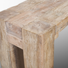Close-up shot focusing on the weathered wood texture and the robust joinery of the table corner