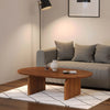 Lifestyle shot featuring the Domingo coffee table styled on a geometric rug in a contemporary lounge area