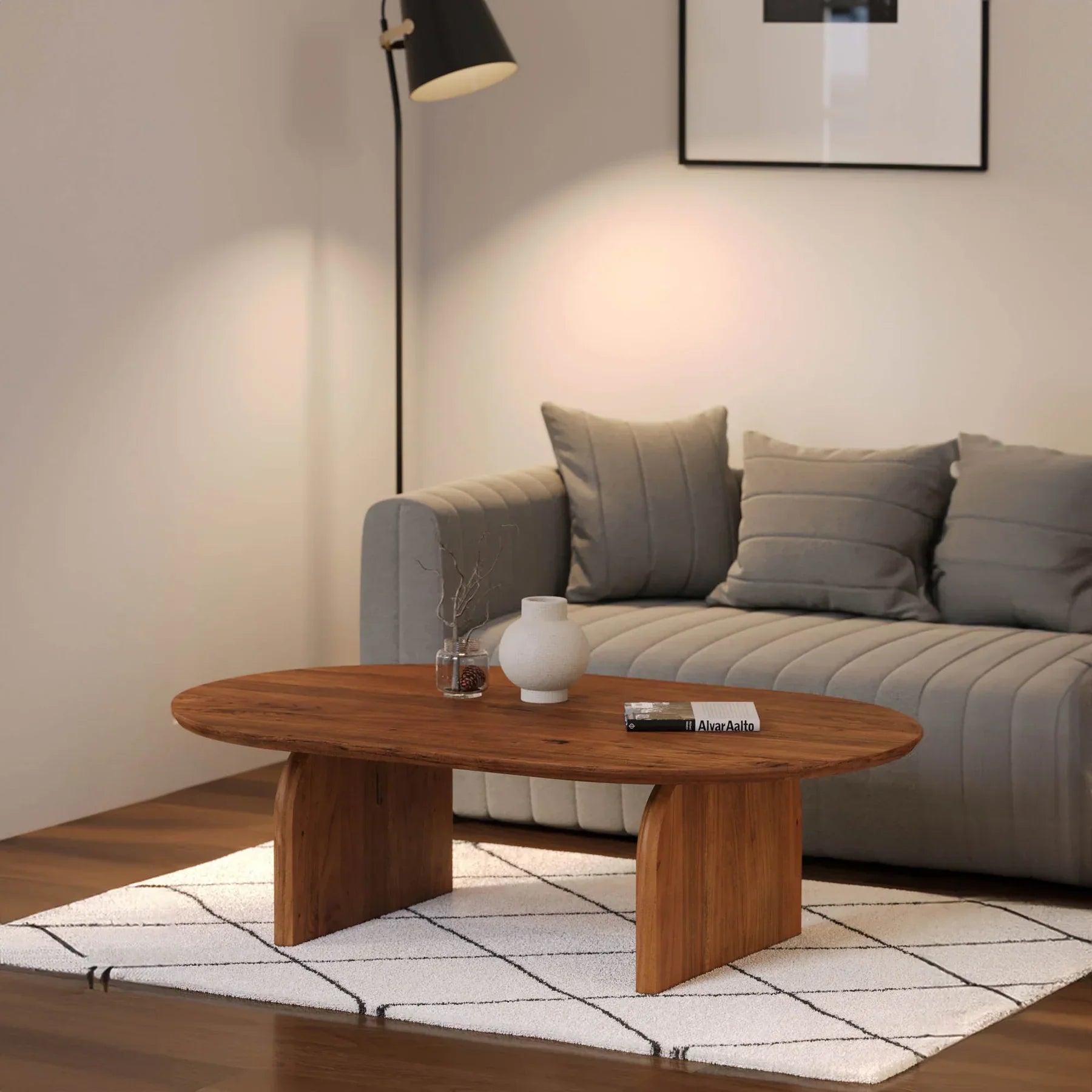 Lifestyle shot featuring the Domingo coffee table styled on a geometric rug in a contemporary lounge area
