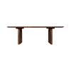 Straight eye-level view emphasizing the minimalist low-profile silhouette and thin tabletop edge