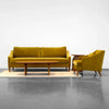 Full room view showing the Domingo coffee table paired with a matching yellow sofa and armchair suite
