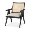 Angled view of Donna cane-back accent chair with beige upholstered seat