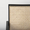 Close-up of cane backrest detail on Donna accent chair