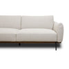 Front view of Idony sofa in beige fabric with curved arms, wooden base, and black metal legs
