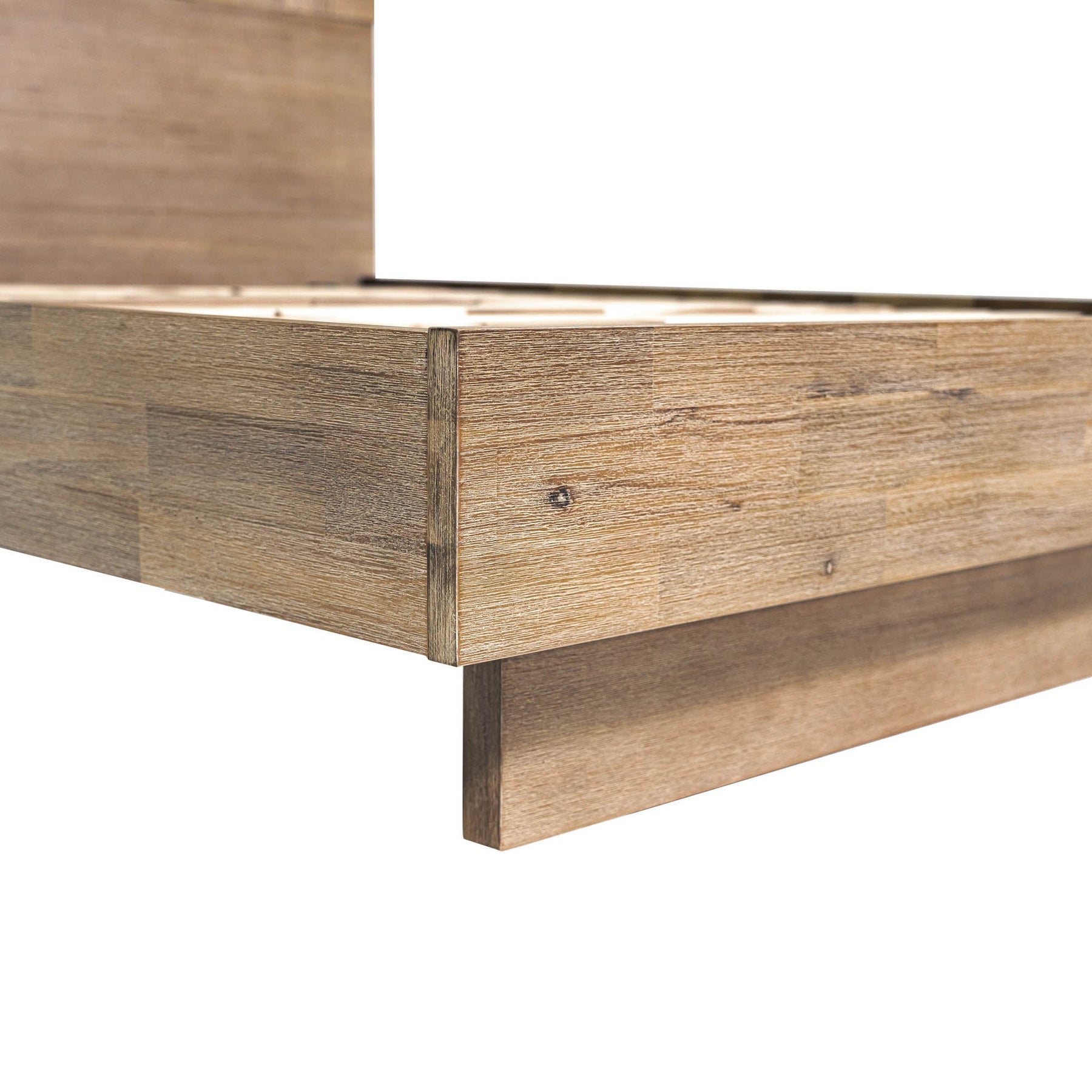 Front view of the Atlantis platform bed featuring a tall headboard with a unique patchwork wood inlay and light driftwood finish