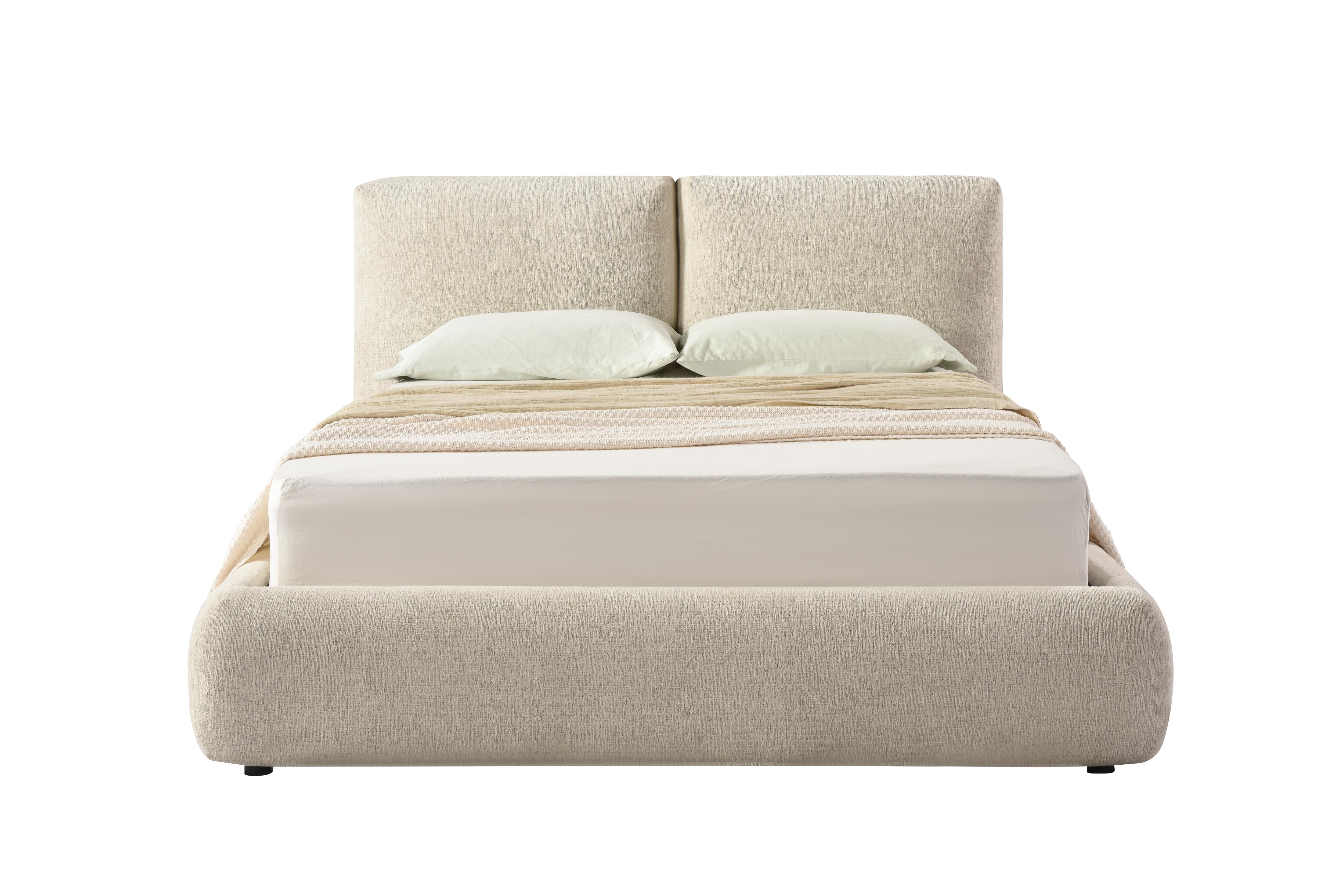 Front view of the Drom upholstered storage bed featuring a low-profile cream bouclé frame and a unique split-panel cushioned headboard