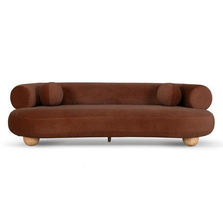 Ebba sofa in textured cream fabric with rounded arms and decorative circular pillows