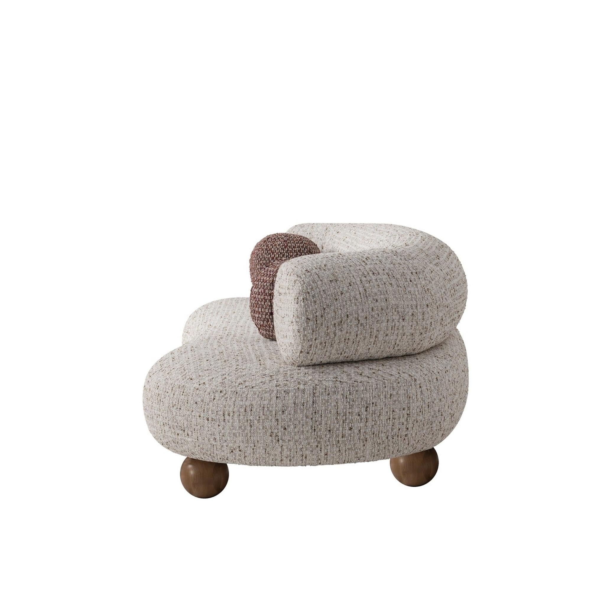 Ebba sofa in textured cream fabric with rounded arms and decorative circular pillows