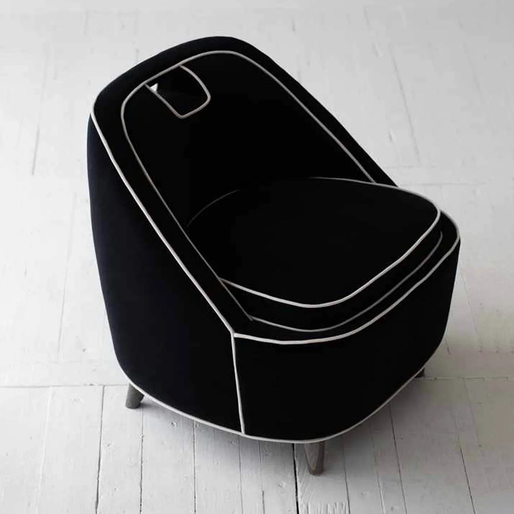 High-angle shot highlighting the unique cutout handle and circular seat design