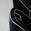 Detailed view of the integrated upholstered handle on the upper backrest