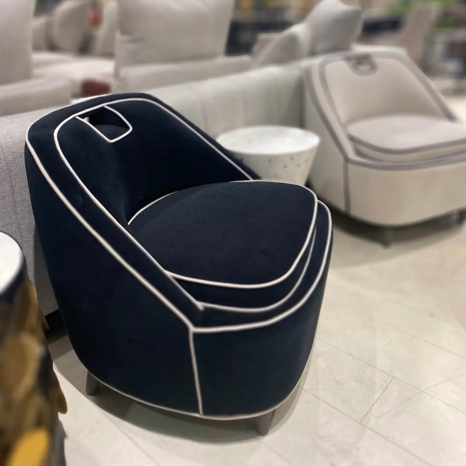 A deep navy blue variant of the Ebony chair styled in a bright modern interior