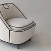 Close-up of the black piping detail around the integrated handle on the cream backrest