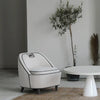 Lifestyle shot of the Ebony chair in a rich emerald green velvet upholstery