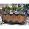 Lifestyle shot highlighting the sideboard styled in a high-end interior setting alongside a natural wood dining table