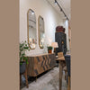 Wide-angle showroom shot featuring the sideboard alongside complementary furniture in an open-concept space