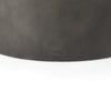 Macro view showcasing the natural organic wood grain patterns and warm brown finish of the circular tabletop