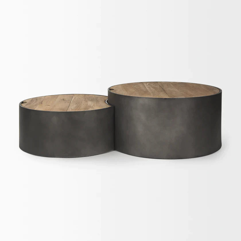 Front view of the Eclipse nesting coffee table set featuring two circular brown wood tops on dark gunmetal gray metal drum bases