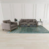 Lifestyle shot featuring the Eclipse table styled in a formal living room with a grey sofa set and matching marble coffee table