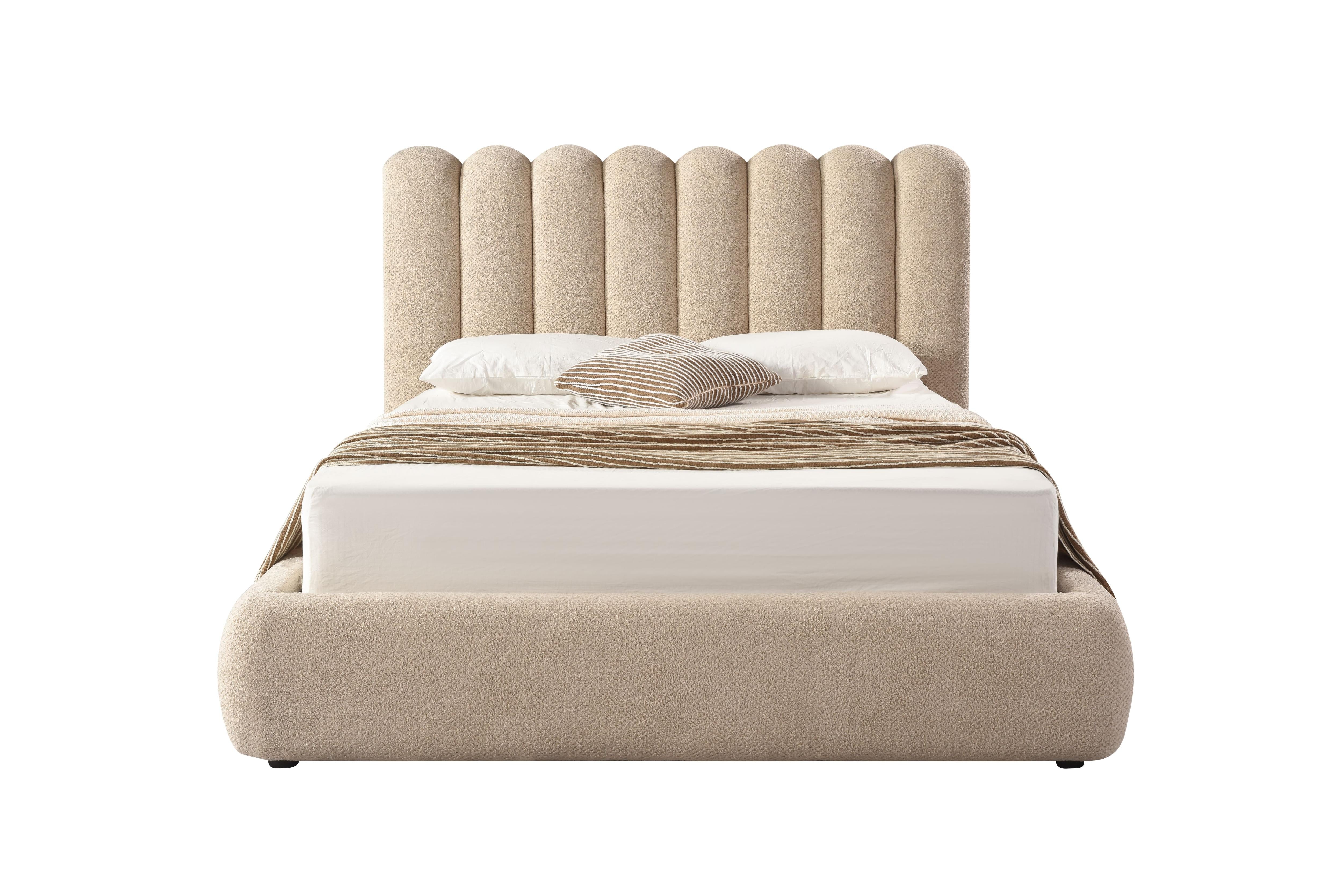 Front view of the Eira upholstered storage bed featuring a cream bouclé finish and a unique curved scalloped headboard