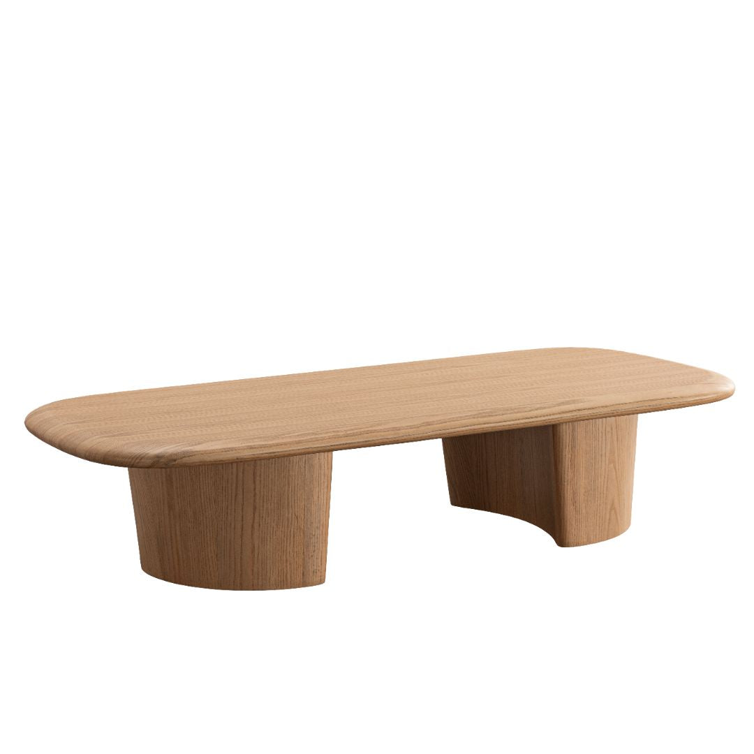 Three-quarter perspective highlighting the smooth curved edges and solid wood construction of the Ekera coffee table