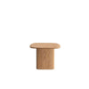 Front view of the Ekera side table in natural oak featuring a square tabletop with rounded beveled edges on a solid pedestal base