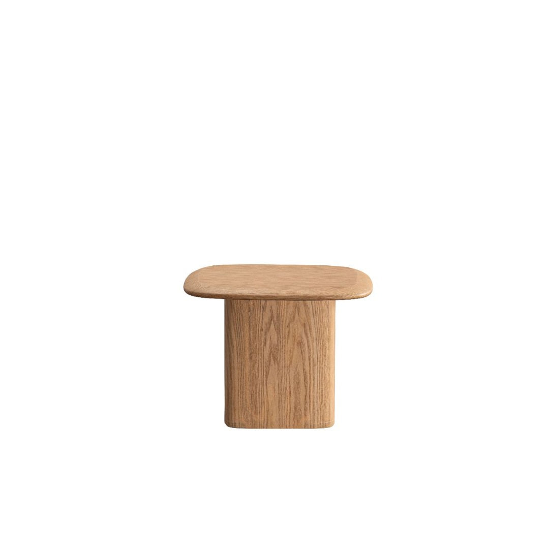 Front view of the Ekera side table in natural oak featuring a square tabletop with rounded beveled edges on a solid pedestal base
