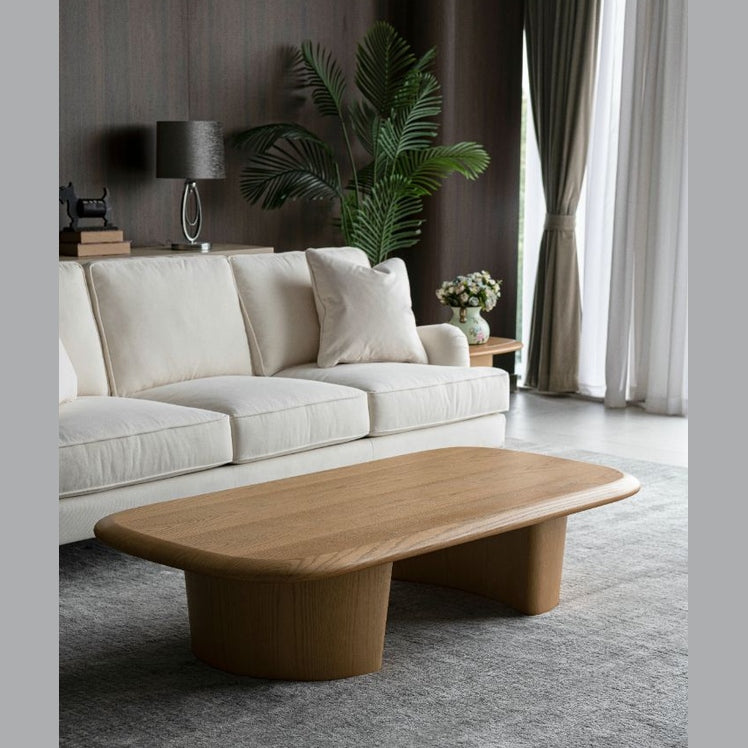 Lifestyle shot featuring the Ekera coffee table styled in a bright modern living room with a white sofa and neutral rug