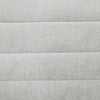 Macro detail shot highlighting the soft woven platinum fabric and the depth of the horizontal channel stitching