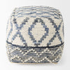 Front view of the Eshana cubic pouf featuring a hand-woven cream wool and blue denim diamond pattern with raised pom-pom texture