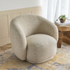 The Estelle chair placed in a warm, sunlit corner showing its scale and cozy, inviting texture.