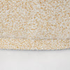 Close-up of the high-quality stitching and seam work on the base of the Estelle rounded accent chair.