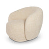 Three-quarter view of the Estelle chair showcasing its low-profile base and organic, rounded armchair design.