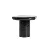 High-angle profile shot emphasizing the clean lines and modern sculptural form of the high-gloss black accent table