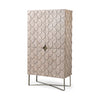 Three-quarter perspective view of the Excelsior II storage cabinet featuring a light brown wood finish, a decorative scalloped motif on the doors, and a gold iron X-base