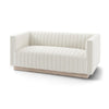 Angled 3/4 view of the Fest Tuscany cream loveseat showing vertical channel tufting