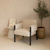 Forest club chair in ivory fabric styled in a living room