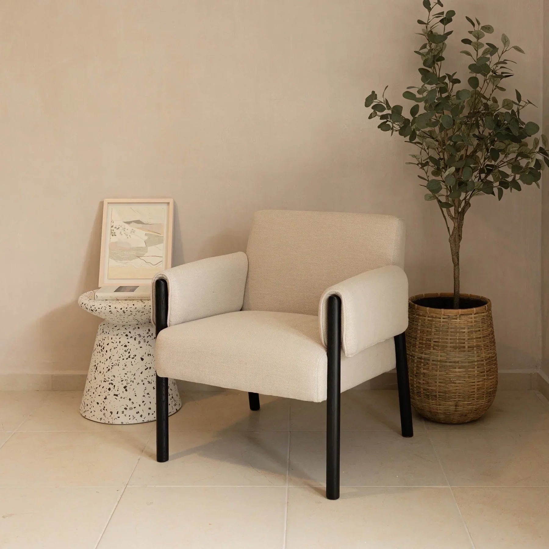 Forest club chair in ivory fabric styled in a living room